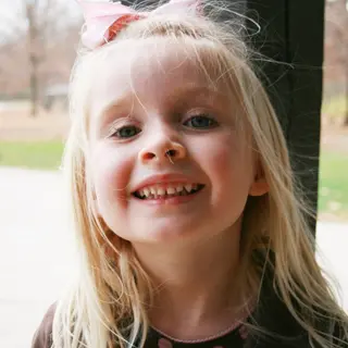 Maya smiling outdoors